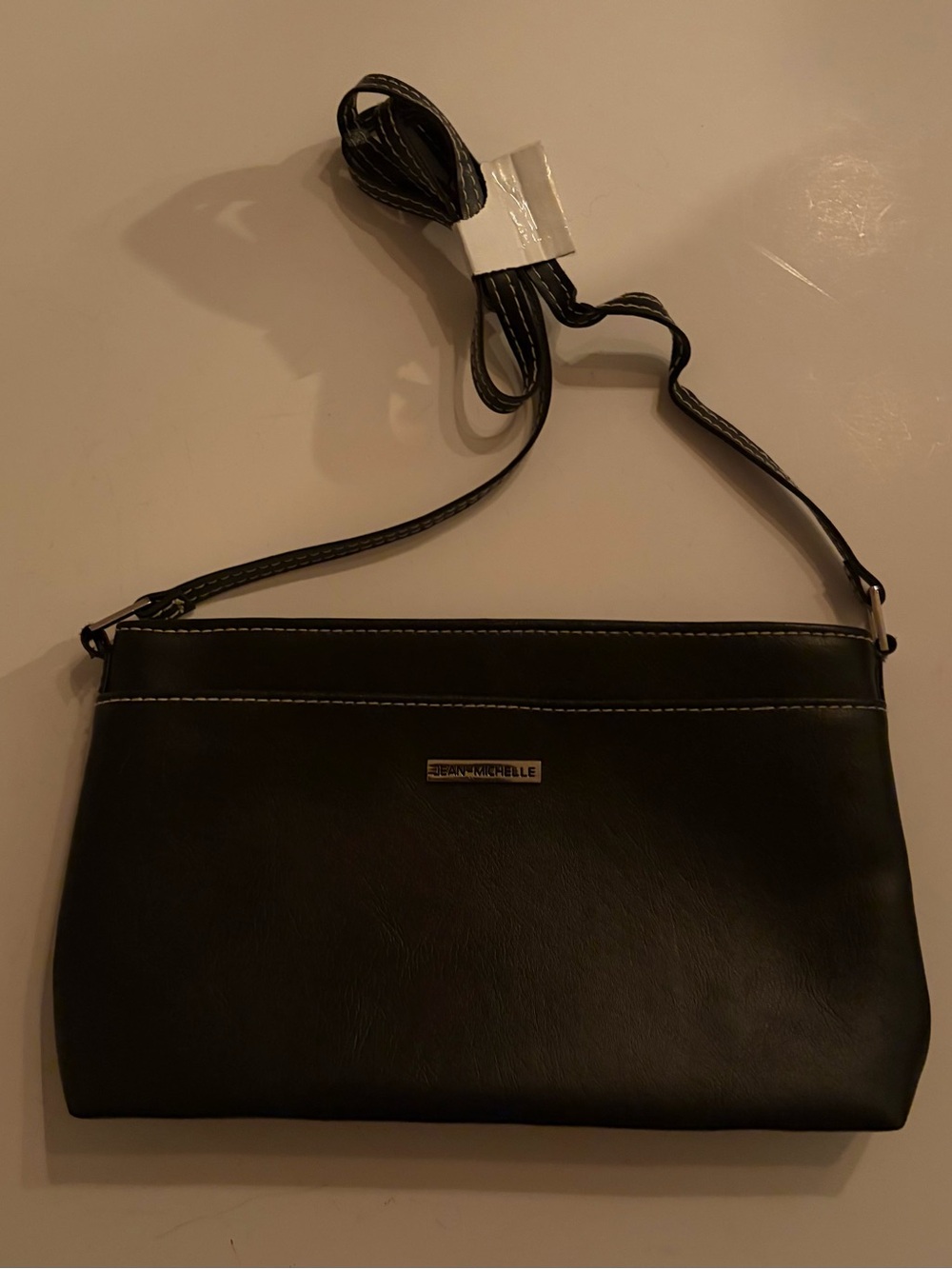 JEAN-MICHELLE faux leather crossbody bag.